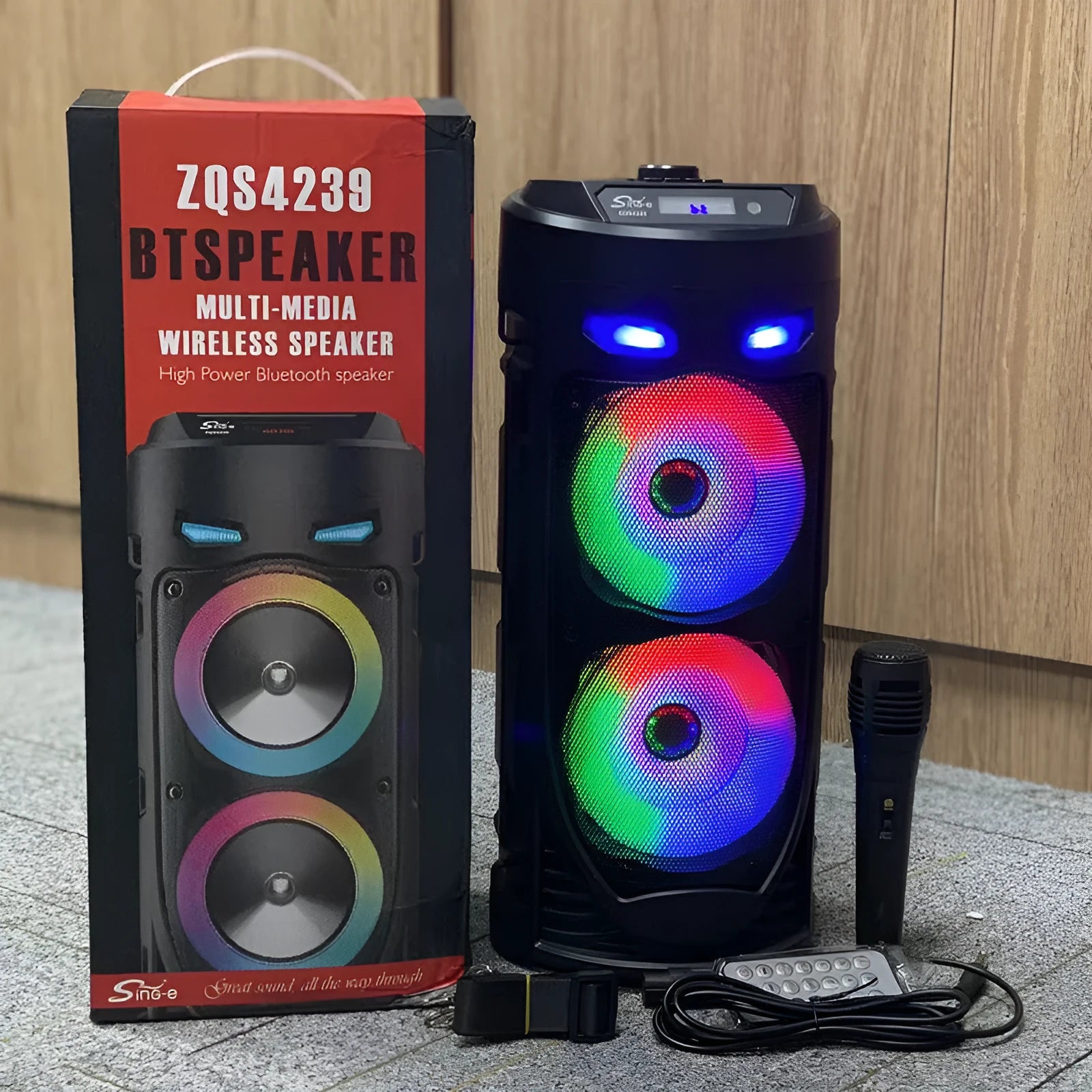 Black portable Bluetooth speaker with dual horn cannon design showing USB charging port and compact dimensions
