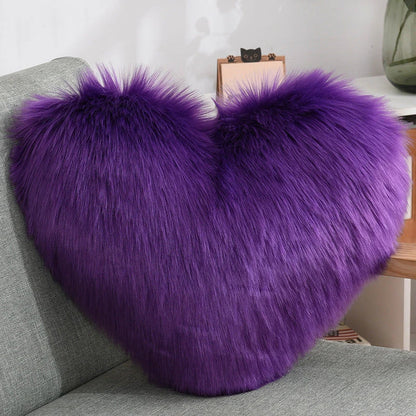 Plush heart-shaped throw pillows in various colors and styles for cozy sofa decor