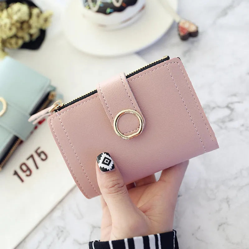 Women's PU leather buckle ring wallet in compact 12x9cm size with card slots and coin section.