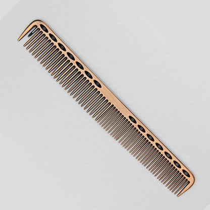 Space aluminium haircut comb in rose gold finish showing precise tooth spacing and polished metal surface