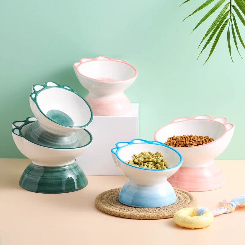 Ceramic pet bowl with cartoon paw design and 15-degree incline for comfortable feeding