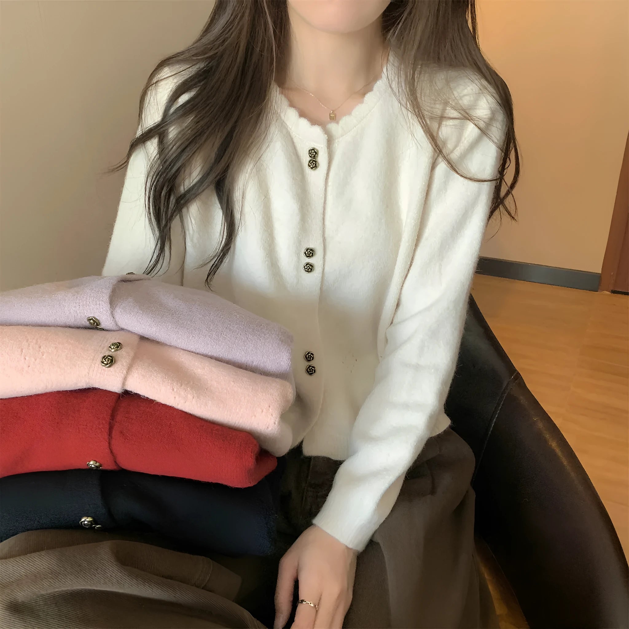 Women's long-sleeved acrylic cardigan coat in milky white, available in four other colours.