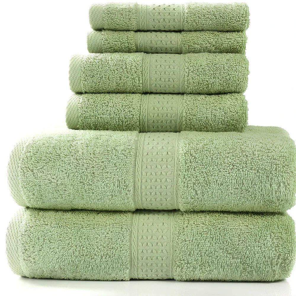 Pure cotton absorbent towel set in bamboo green, showing 140x70cm bath, 33x73cm hand, and 33x33cm square towels