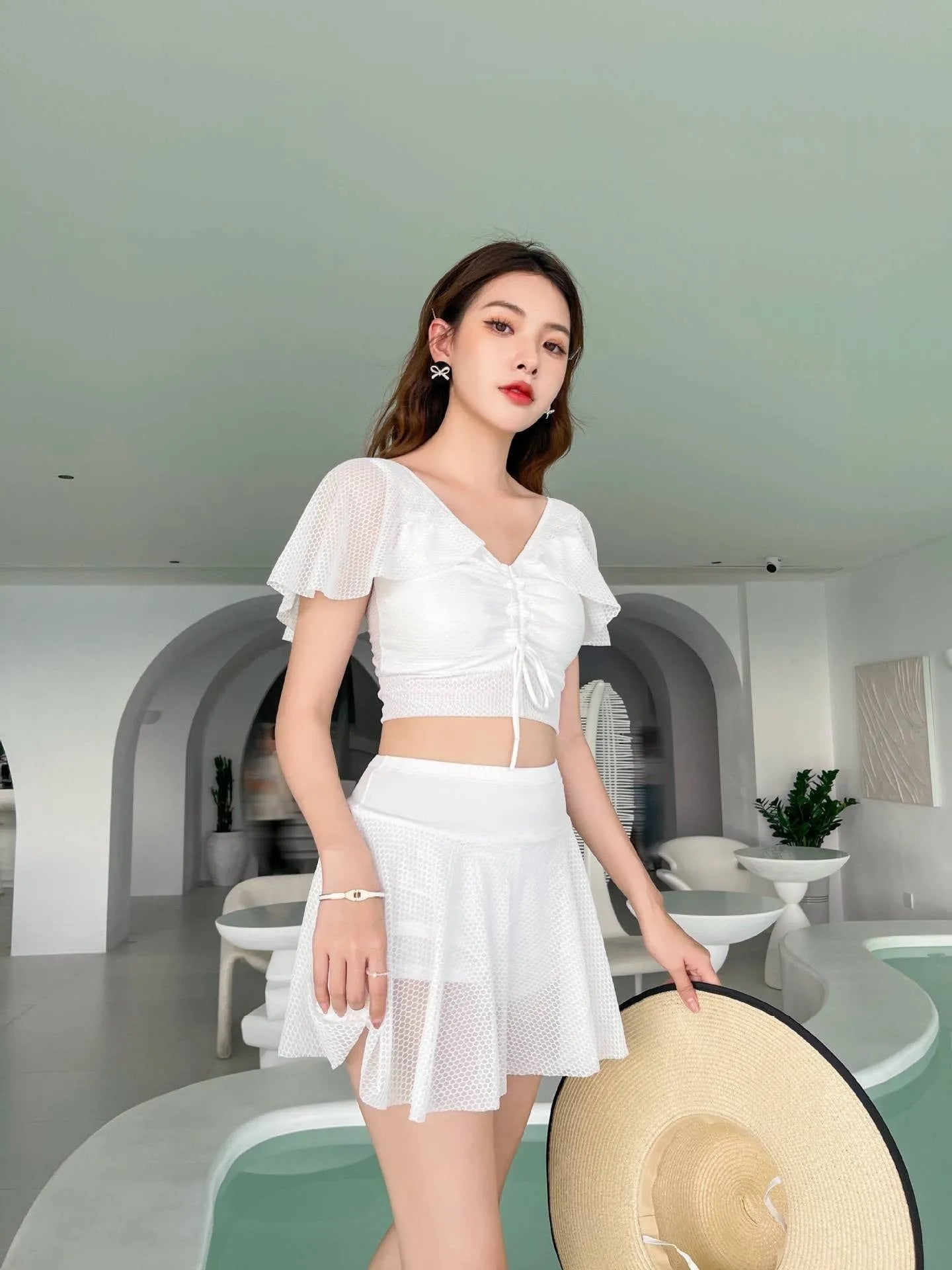 Women's two-piece skirt swimsuit in solid colour with separate top and skirt components
