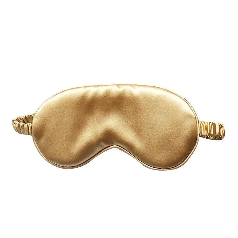 Silk double-sided eye mask in peacock blue and silver with adjustable strap, showing contoured nasal bridge design