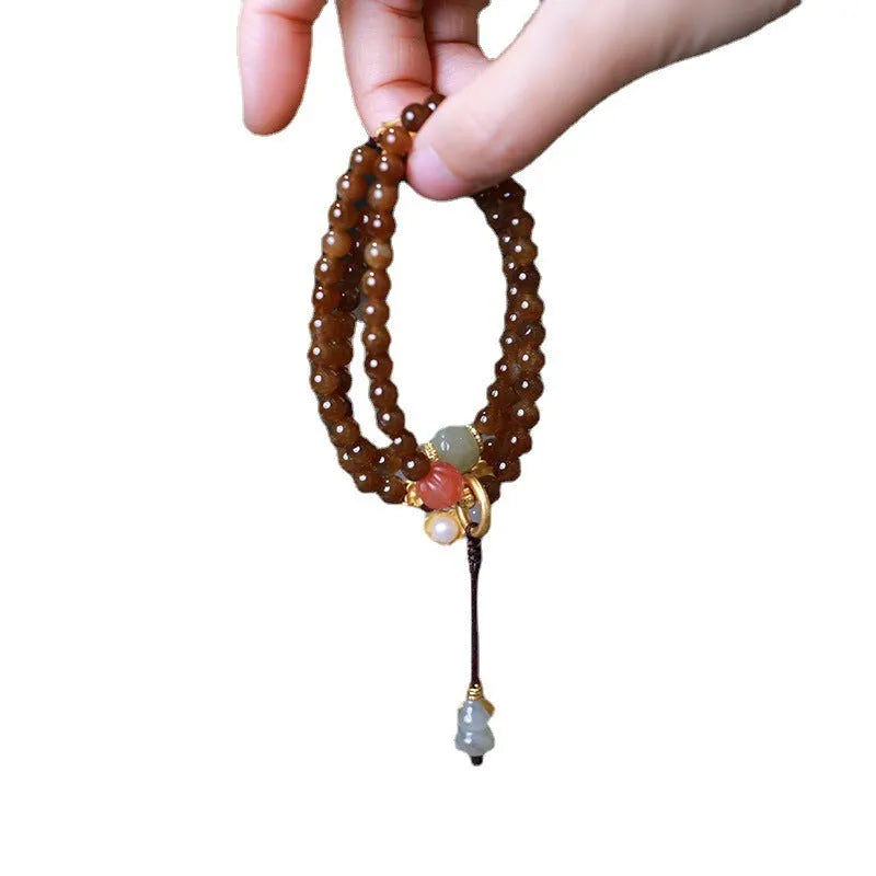 Brown jade Hetian jade three-ring bracelet with silver butterfly and gourd charms