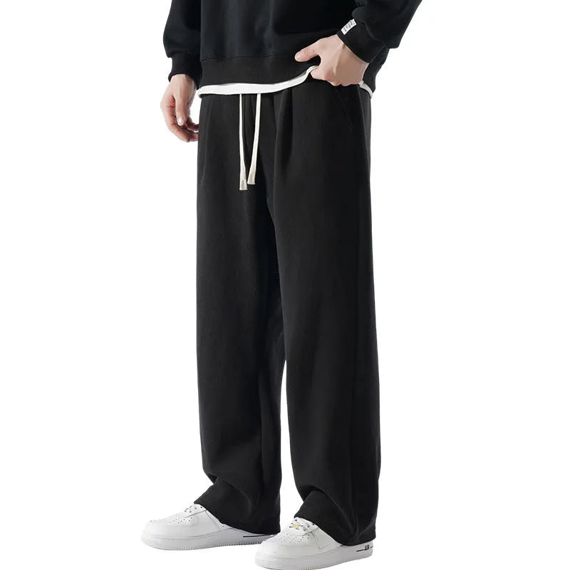 Men's double-sided polar fleece winter trousers in apricot colour showing loose Korean style and drawstring waist