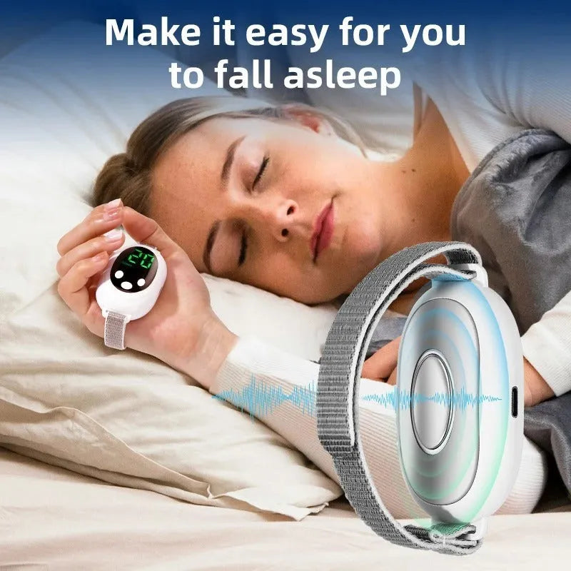 White handheld sleep aid instrument with remote control, sleep bracelet, and USB charging cable on a neutral background.