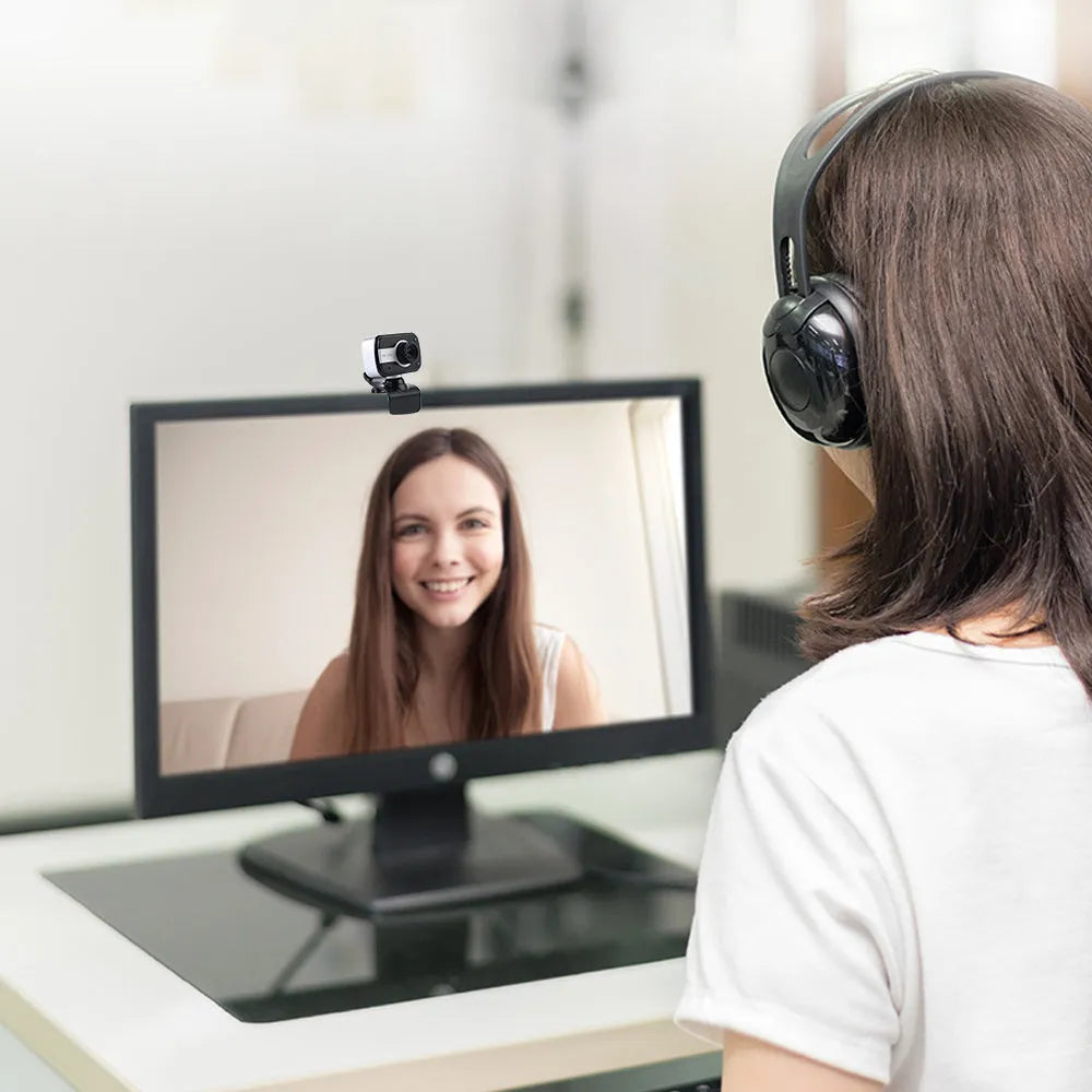 Mini USB webcam with rotating base in blue, red or white colours for PC video calling.