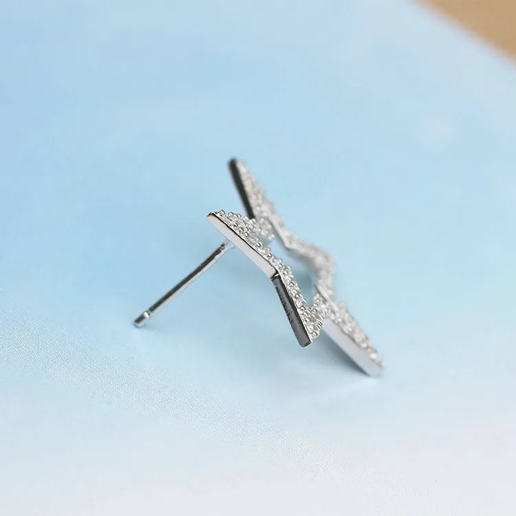S925 sterling silver micro-inlaid five-pointed star stud earrings, Korean style, for women on a white background