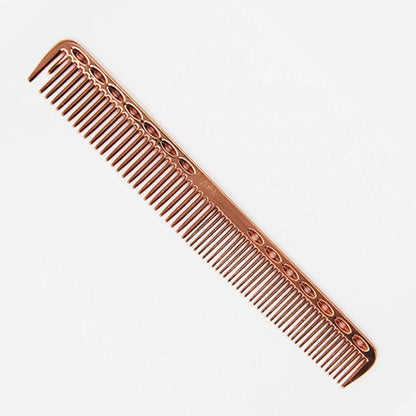 Space aluminium haircut comb in rose gold finish showing precise tooth spacing and polished metal surface