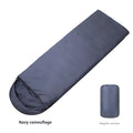 Navy blue envelope camping sleeping bag for adults on outdoor ground