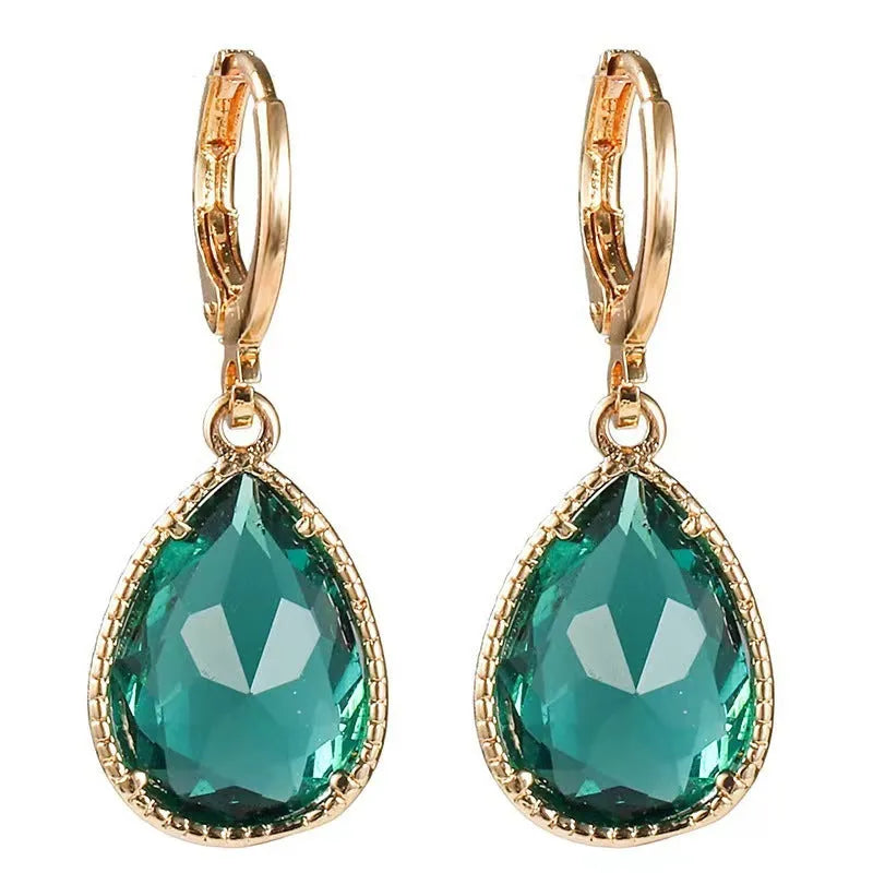 Geometric glass water drop earrings with Saturn design in colourful rare earth options on copper mixed material