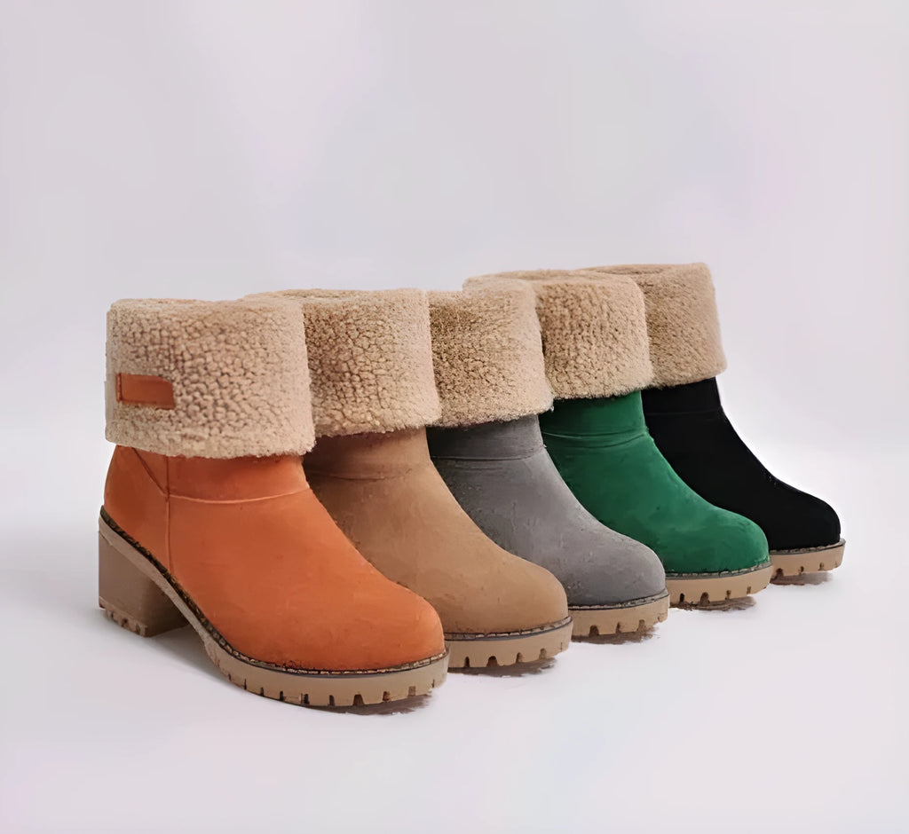 Women's black suede mid-calf Martin boots with a round toe and low flat heel.
