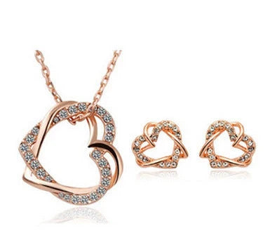 Double diamond heart necklace and earring set in silver and gold