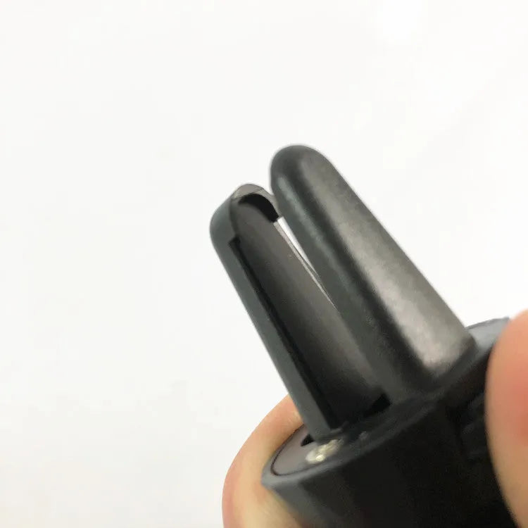 Glory black magnetic car phone holder attached to a car air vent