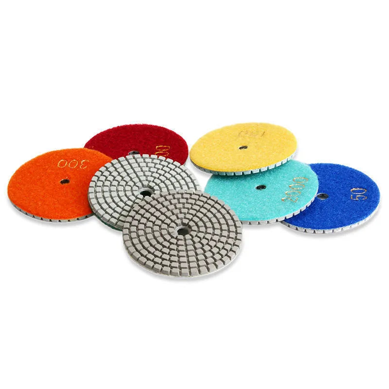 Set of 10 stone polishing pads showing different grits, 80mm diameter with 10mm centre holes