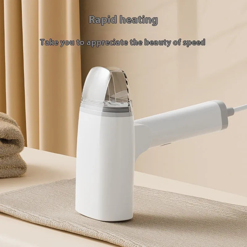 Blue and white handheld garment steamer with water tank and nozzle on a white background