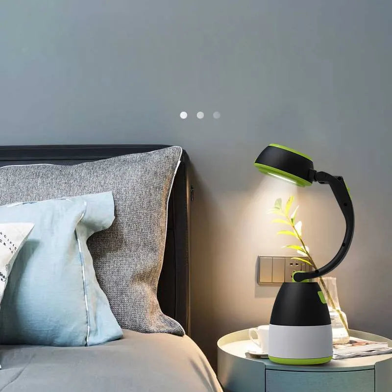 Black green multifunctional LED table lamp showing adjustable head and USB charging port.