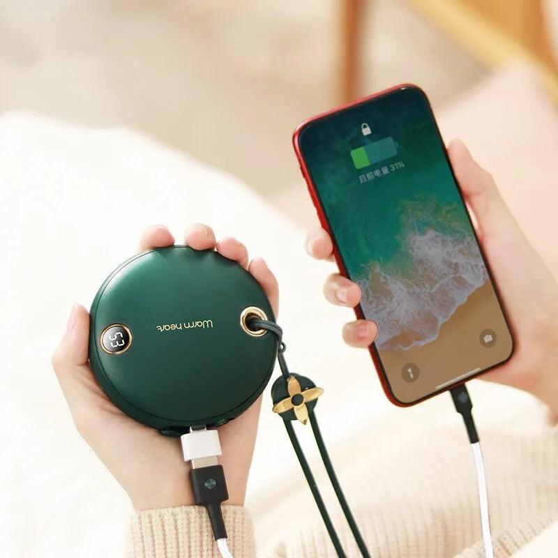 Green hand warmer power bank with digital display showing battery percentage