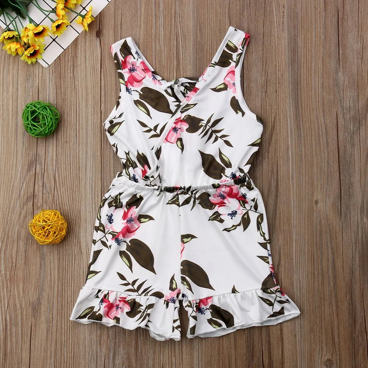 Baby girl wearing cotton floral summer outfit in white or yellow colour