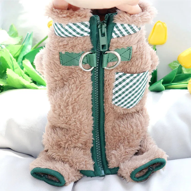 Green plush fleece dog jumpsuit on a small dog, showing zipper back and leg coverage.