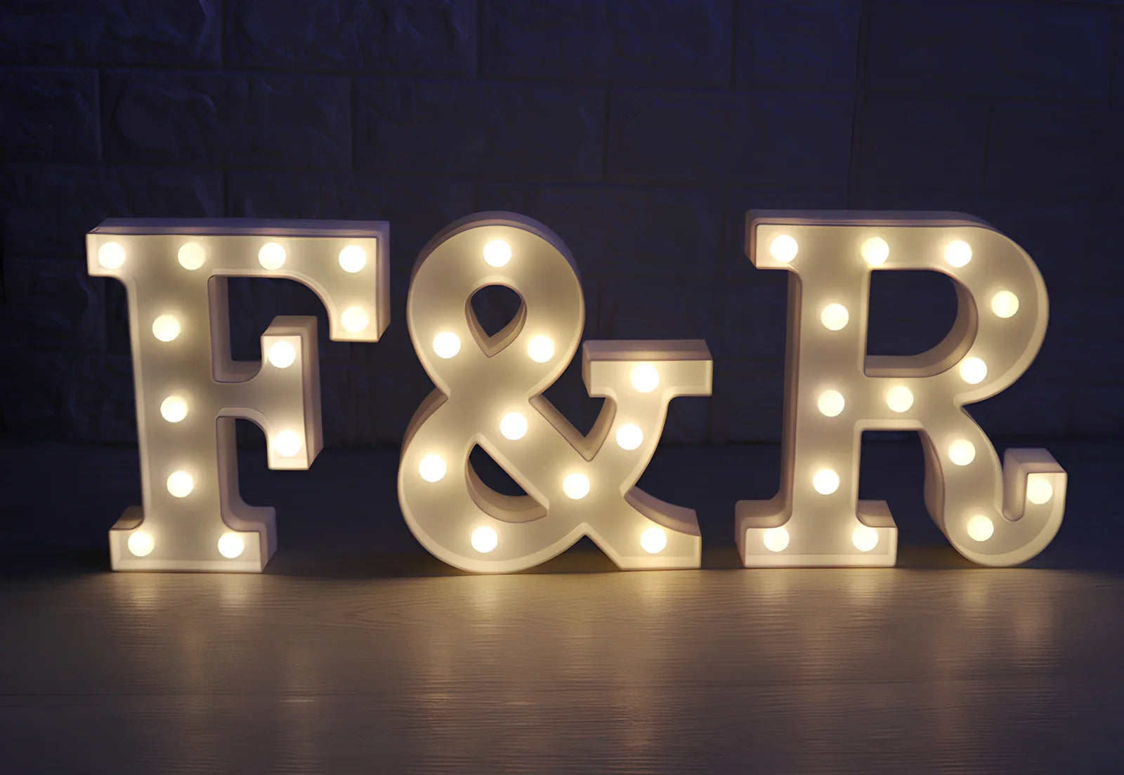 White plastic LED alphabet marquee sign with warm white illumination, 22cm height with battery operation