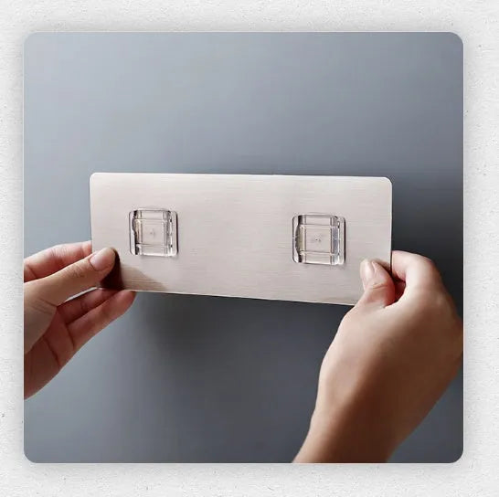 White plastic kitchen knife rack mounted on wall with dimensions 10.6 cm wide by 26 cm tall