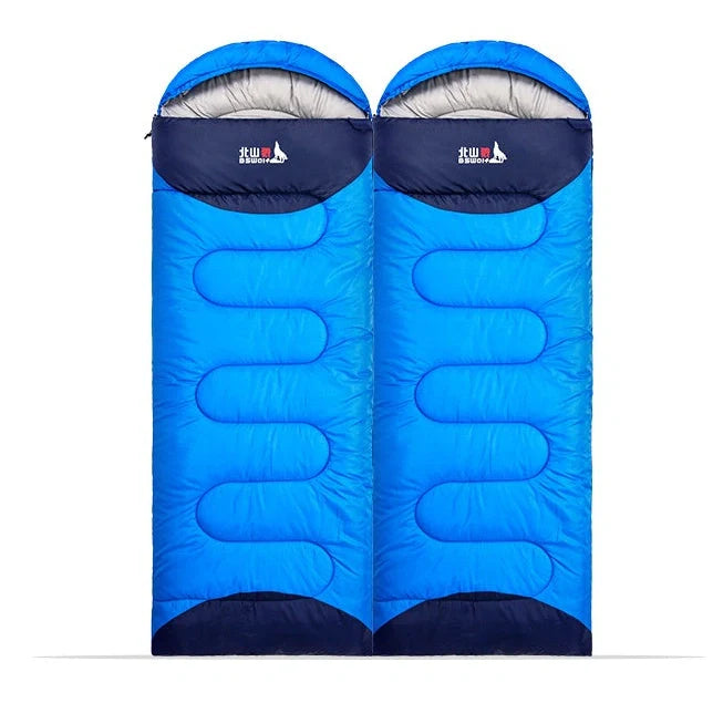 Blue camping sleeping bag with removable inner liner, compression straps, and waterproof 190T polyester shell