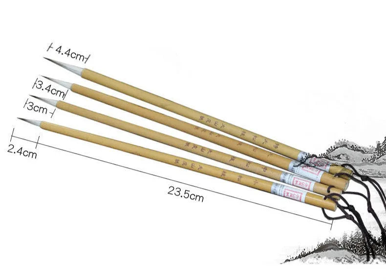 Set of four gold-coloured writing brushes with mixed hair bristles for calligraphy.