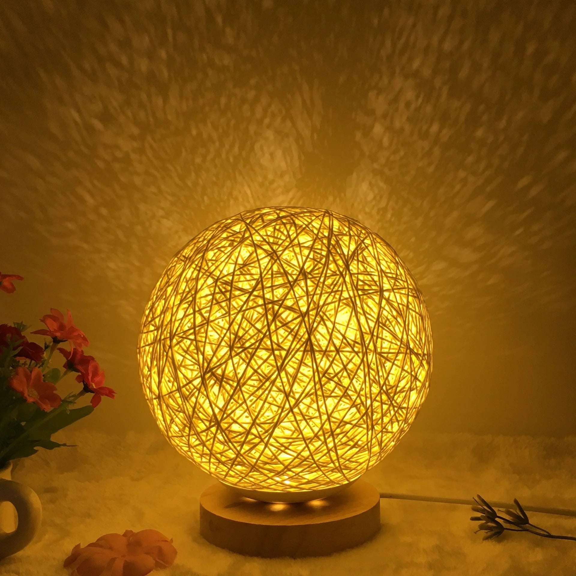 LED rattan table lamp with hand-knit lampshade in various colours