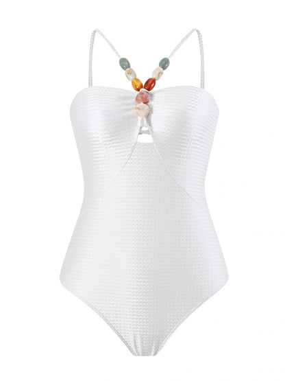 Women's one-piece swimsuit with hollow gem sling design in sapphire blue colour