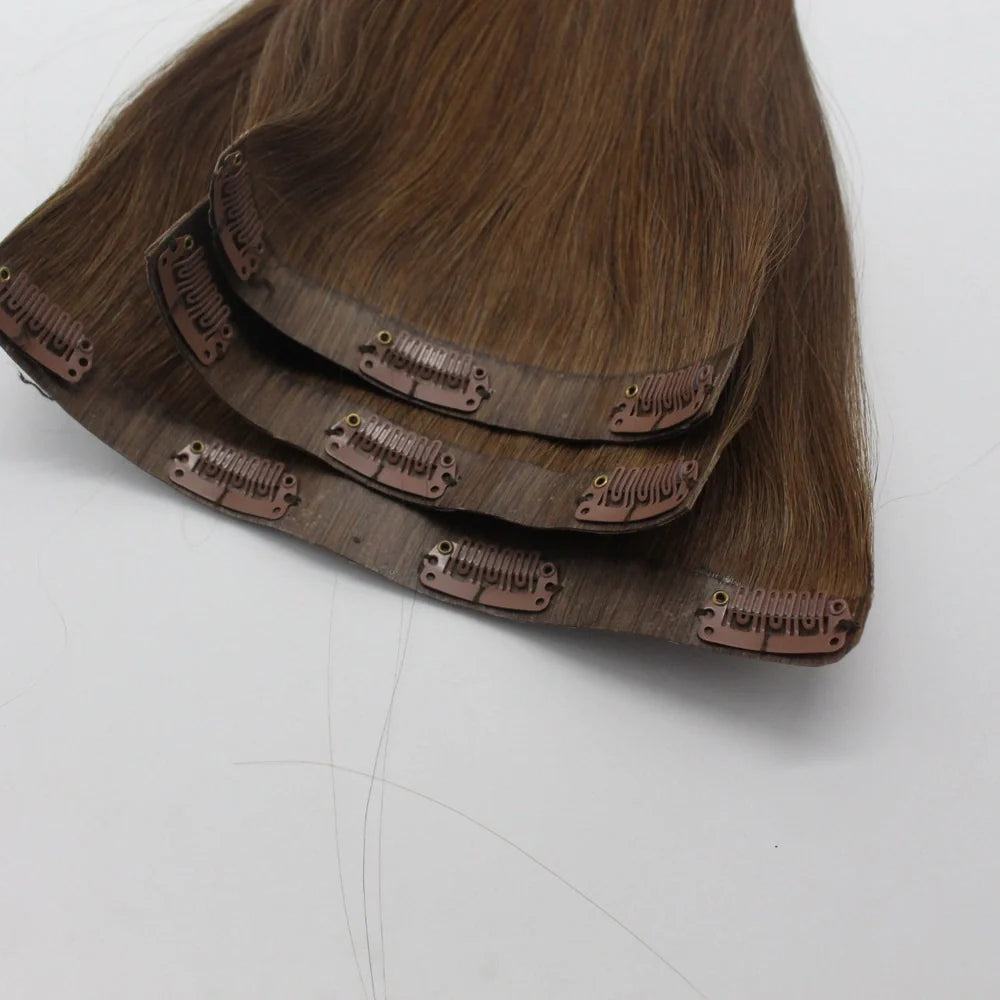 Clip-in human hair extensions in various lengths from 10 to 30 inches with secure attachment clips