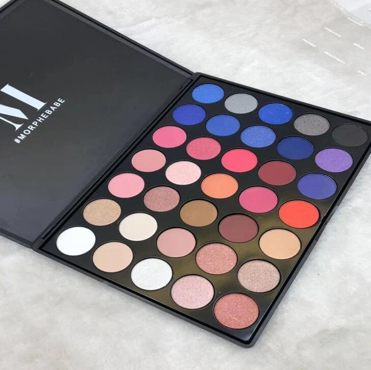 39-colour earth tone eyeshadow palette showing pearlescent and matte finishes in compact with mirror