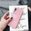 Solid black and solid pink painted phone back covers for Huawei and Honor smartphones on a white background.