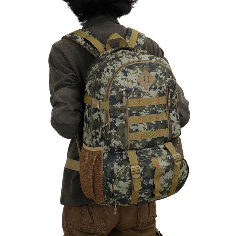 50L camouflage outdoor mountaineering backpack with Oxford cloth construction on rocky terrain