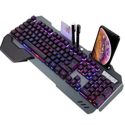 Black wired gaming keyboard with RGB backlight, phone holder, and magnetic wrist rest on desk