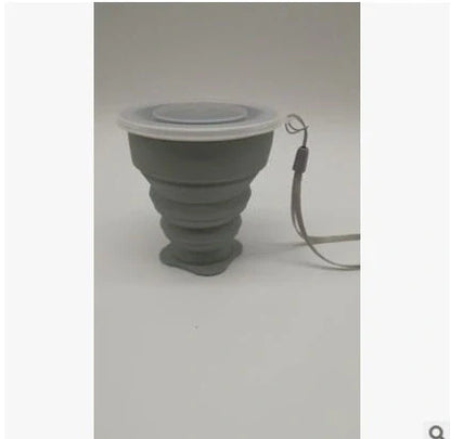 Collapsible stainless steel travel water cup showing expanded and compressed states