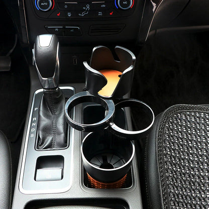 Rotatable ABS car cup holder in green, black, and pink for convenient drink storage