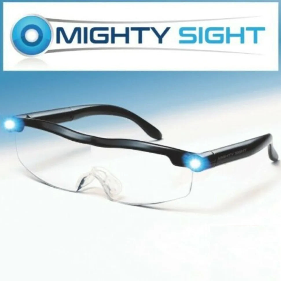 Transparent black USB LED reading glasses with ABS frame on a surface.