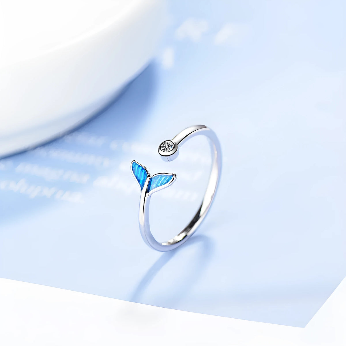Blue mermaid tail cuff ring with cubic zirconia and epoxy accents, adjustable 17mm, white gold finish