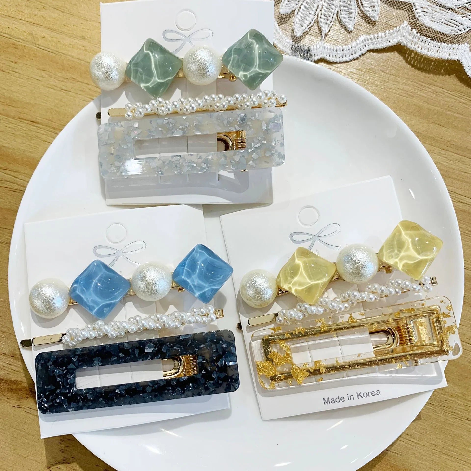 Acrylic pearl hair clip set in various colours including blue, green, pink, purple, white, and yellow