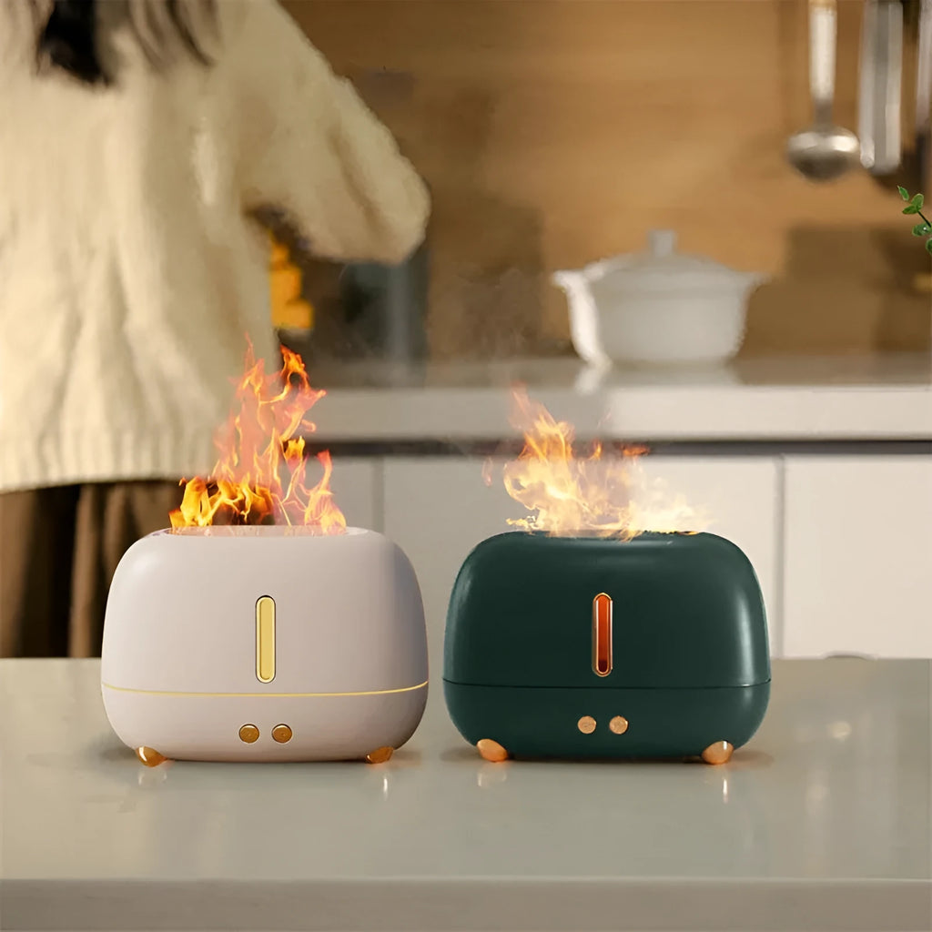 Dark grey flame humidifier with realistic orange LED light and mist output on a wooden table