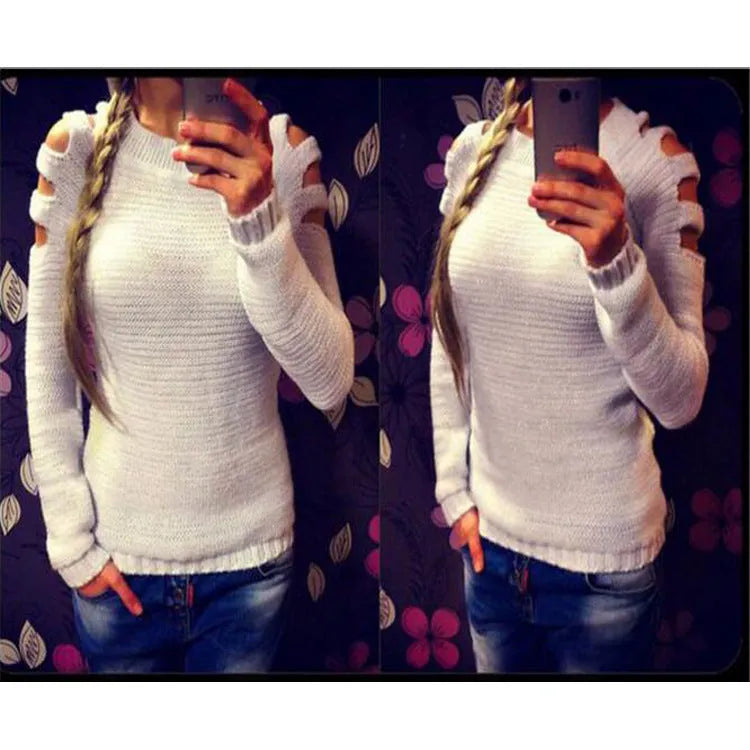 Women's grey hollow-out crocheted knitted long-sleeve shirt with round neck on a hanger.