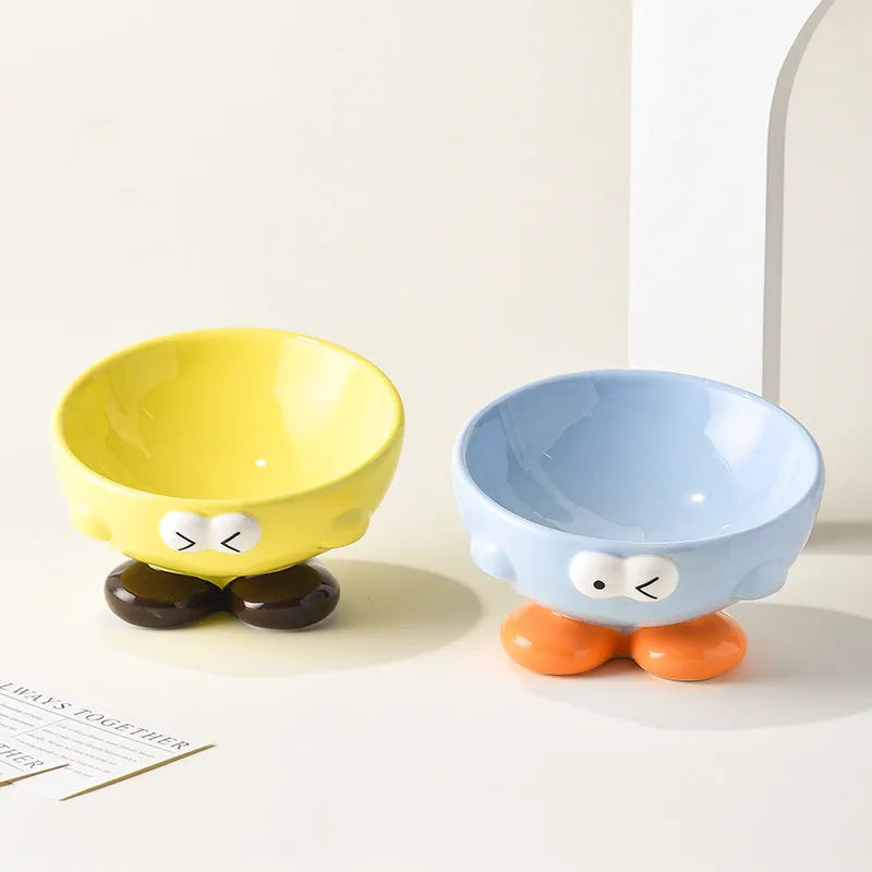 Blue tall ceramic pet food bowl with oblique shape and a silicone non-slip ring on the base.