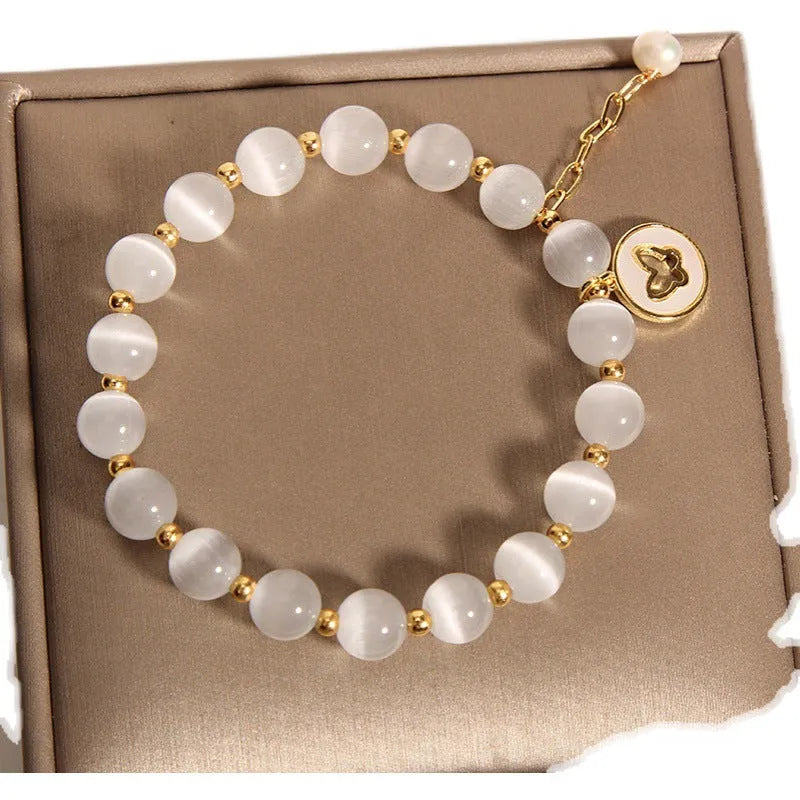 White cat's eye crystal bracelet with geometric design and Korean-style influences