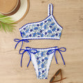 Blue and red one-shoulder floral bikini swimsuit for women laid flat.