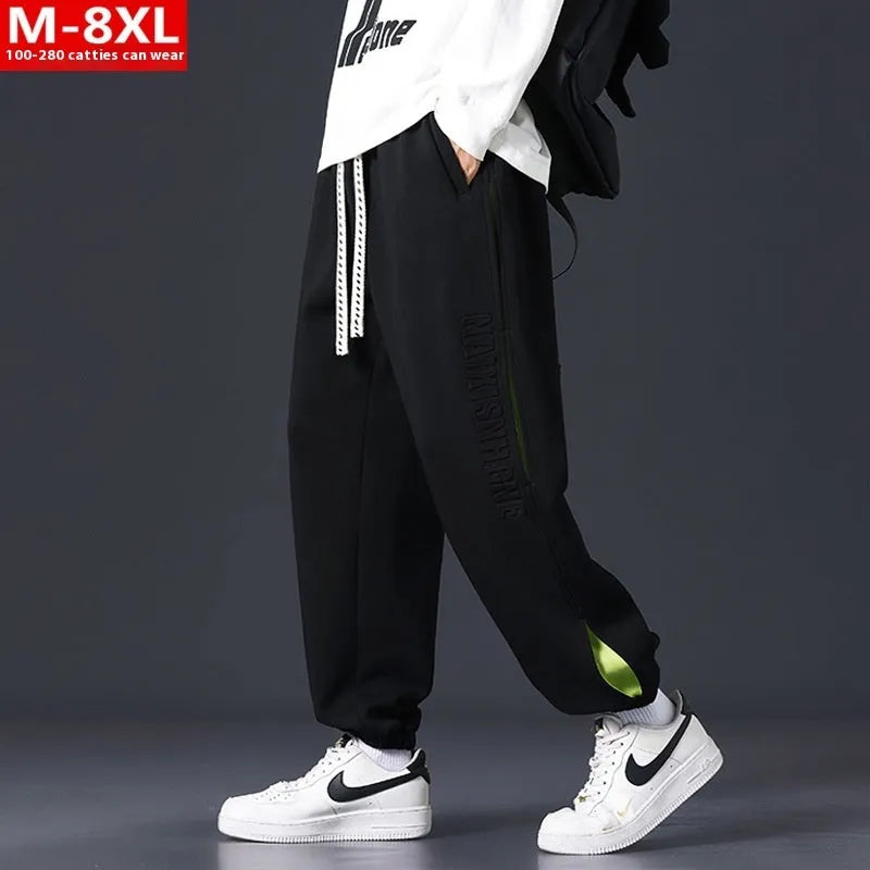 Men's grey green loose fit jogger pants with elasticated ankle bands and waist.
