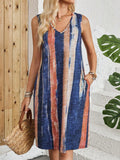 A striped colour block sleeveless dress with a V-neck, shown in a mid-length vest skirt style.