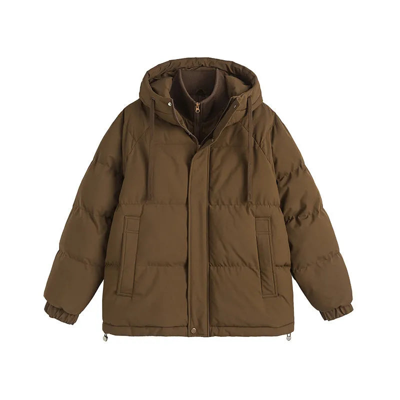 Loose beige winter cotton-padded coat with side pockets on a hanger